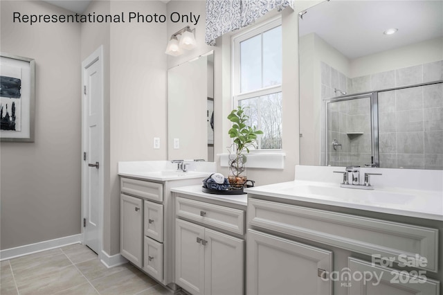 1809 Ab Moore Jr Dr Unit 3238, Indian Trail, NC 28079 - full bath featuring a stall shower, double vanity, and baseboards