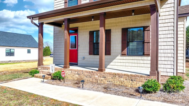 doorway to property with a porch