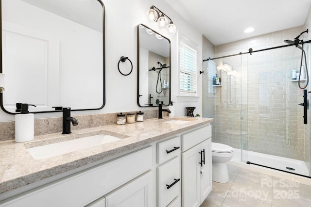 bathroom with a sink and a shower stall