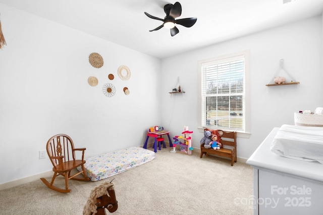 carpeted bedroom featuring a ceiling fan and baseboards