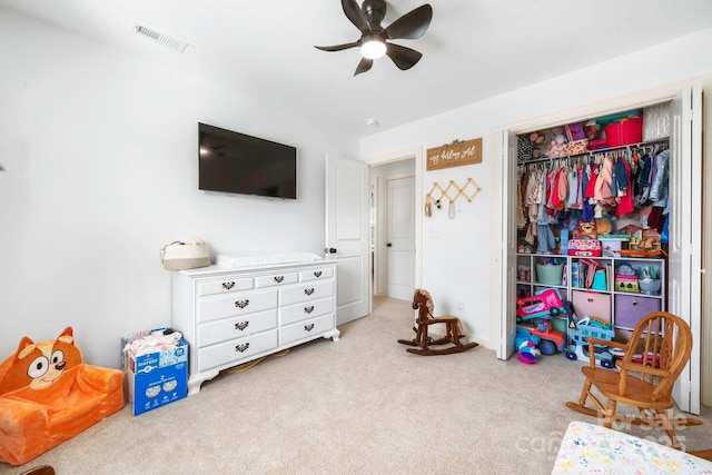 rec room featuring carpet flooring, ceiling fan, and visible vents