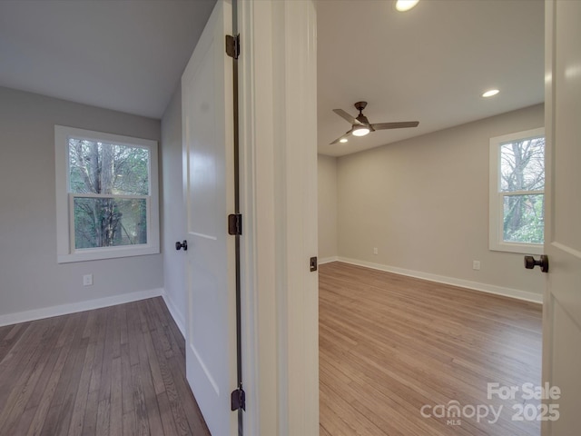 spare room with ceiling fan and light hardwood / wood-style flooring