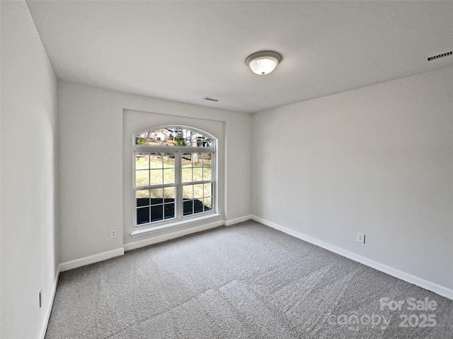 empty room with carpet flooring