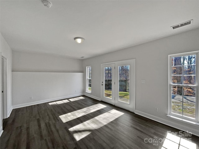 unfurnished room featuring dark hardwood / wood-style floors