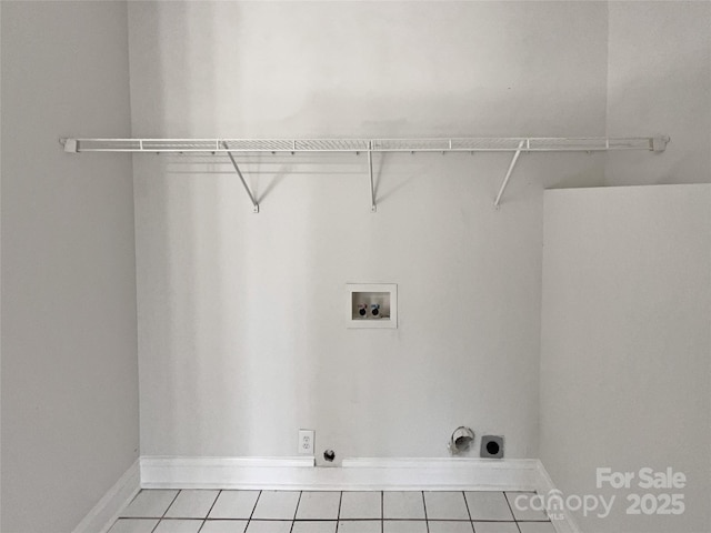 laundry area with washer hookup, hookup for an electric dryer, and light tile patterned flooring