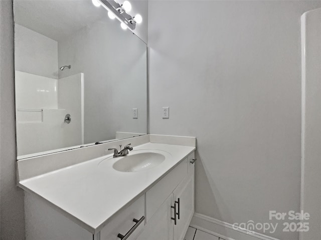 bathroom with vanity and walk in shower