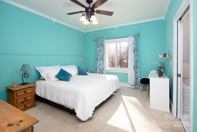 bedroom featuring ceiling fan, ornamental molding, and light colored carpet