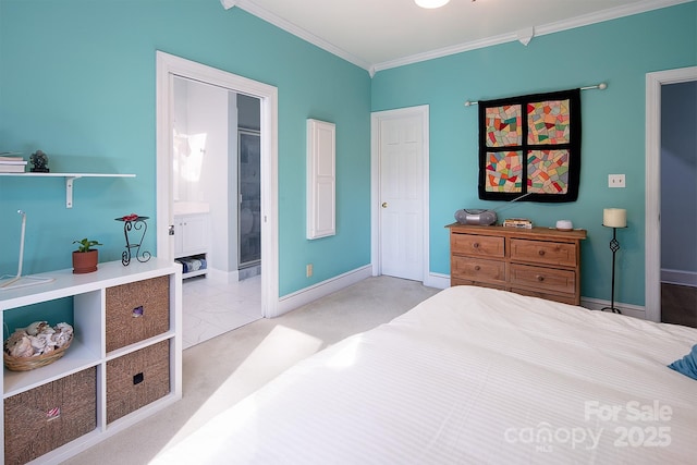 bedroom featuring ornamental molding, marble finish floor, baseboards, and ensuite bathroom