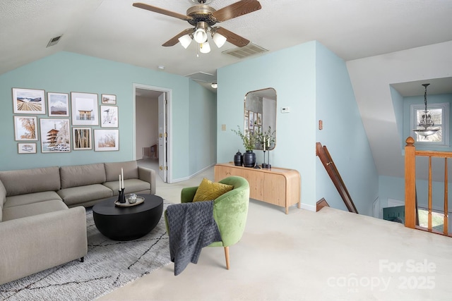 living room with vaulted ceiling, baseboards, visible vents, and a ceiling fan