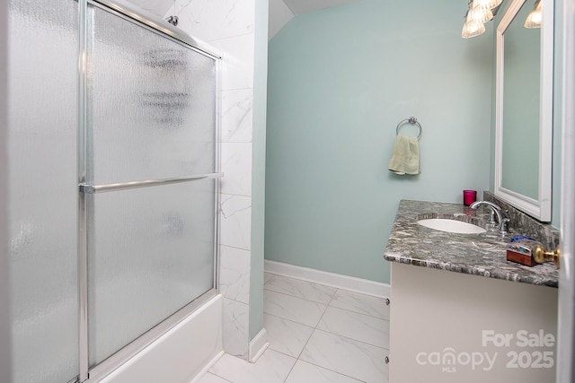 full bathroom with marble finish floor, enclosed tub / shower combo, baseboards, and vanity