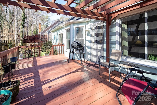 wooden deck with a pergola