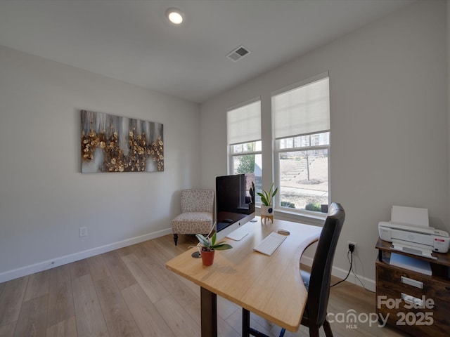 office area with light hardwood / wood-style flooring