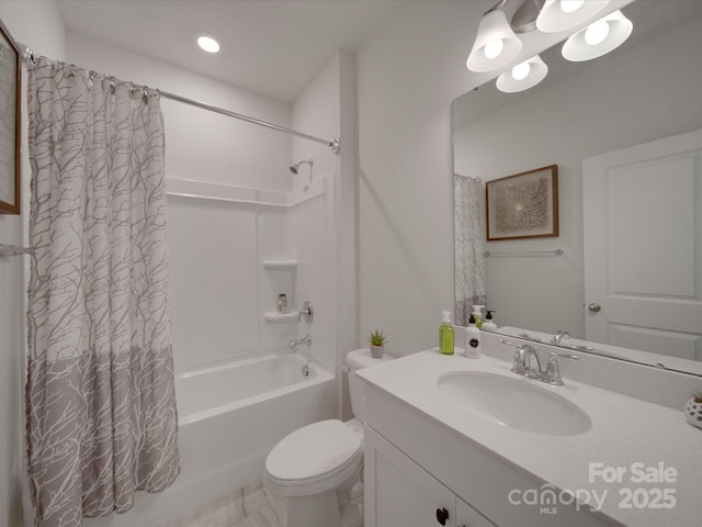 full bathroom featuring vanity, toilet, and shower / bath combination with curtain