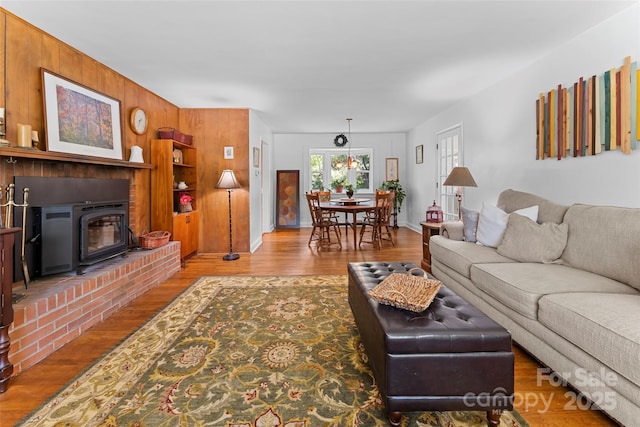 living room featuring hardwood / wood-style flooring and wooden walls