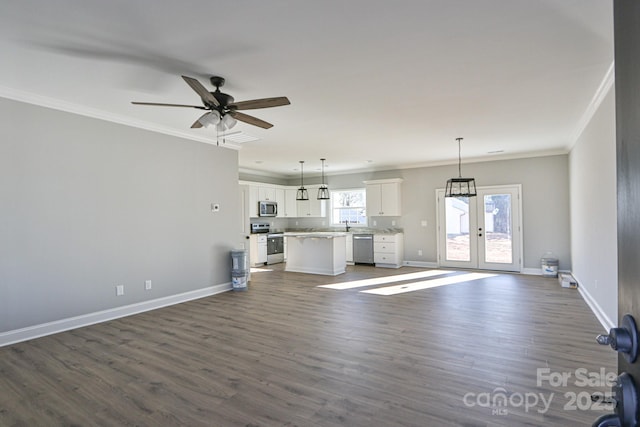 unfurnished living room with french doors, ornamental molding, dark hardwood / wood-style floors, and ceiling fan