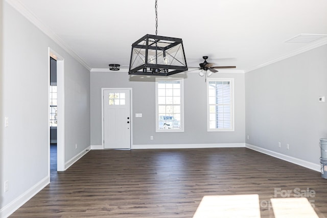 foyer featuring ceiling fan, ornamental molding, and dark hardwood / wood-style floors