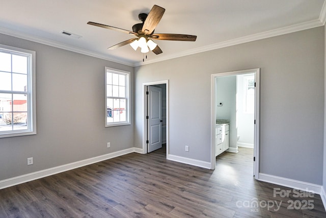 unfurnished bedroom with ceiling fan, connected bathroom, crown molding, and dark hardwood / wood-style floors