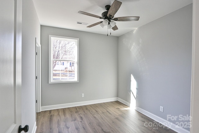 empty room with light wood-type flooring and ceiling fan