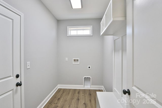 clothes washing area with dark hardwood / wood-style flooring, electric dryer hookup, and hookup for a washing machine