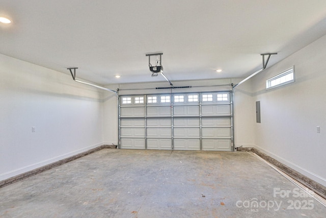 garage with electric panel and a garage door opener