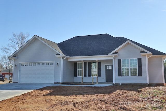 ranch-style home featuring a porch and a garage