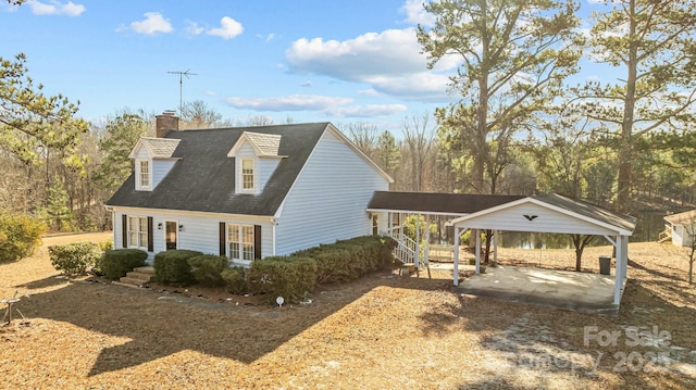 view of front of property featuring a carport