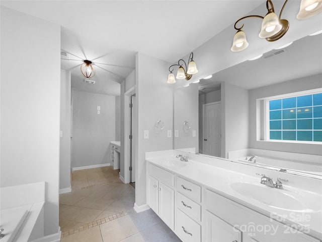 bathroom featuring a sink, a garden tub, visible vents, and tile patterned floors