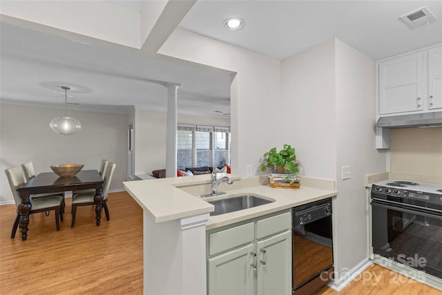 kitchen featuring electric stove, black dishwasher, visible vents, light countertops, and under cabinet range hood