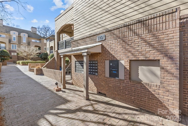 exterior space featuring brick siding