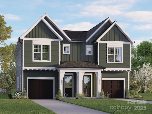 view of front of house with board and batten siding, a front lawn, driveway, and a garage