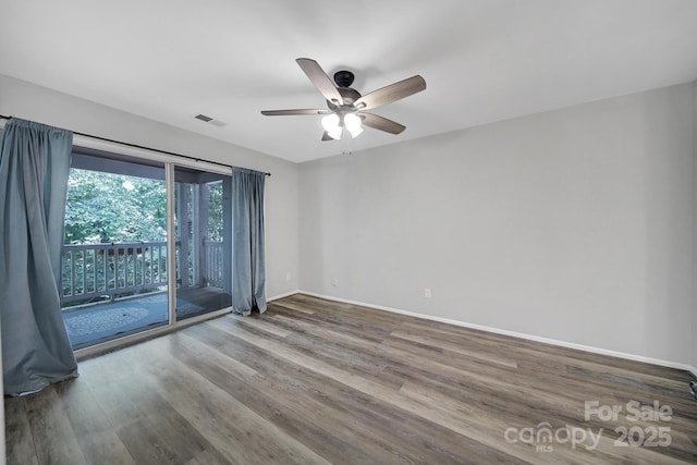 empty room featuring hardwood / wood-style flooring and ceiling fan