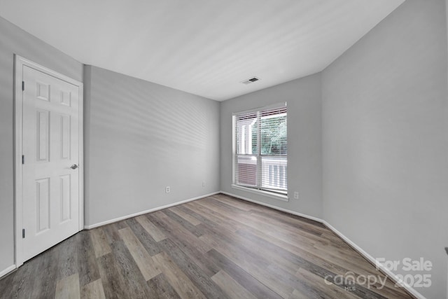 empty room featuring wood-type flooring