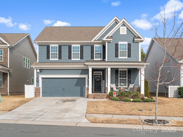 craftsman-style house featuring a garage and a porch