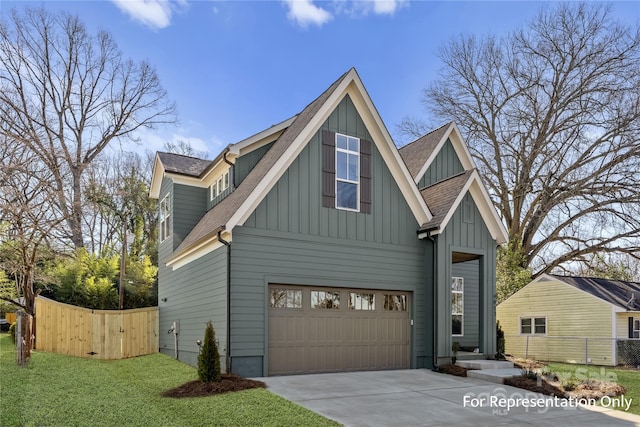 exterior space with driveway, fence, roof with shingles, board and batten siding, and a garage