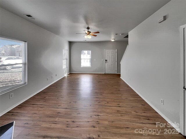 8353 Ainsworth St, Charlotte, NC 28216 - entryway with dark wood-style flooring, visible vents, ceiling fan, and baseboards