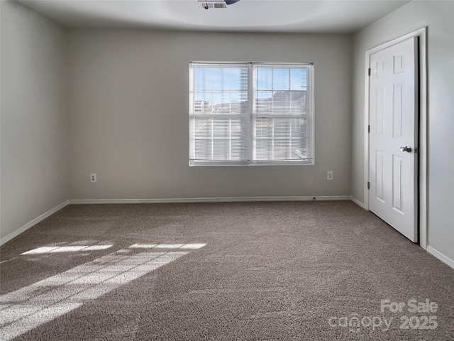 8353 Ainsworth St, Charlotte, NC 28216 - carpeted spare room with baseboards