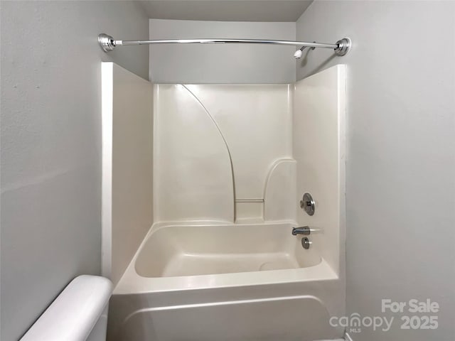 8353 Ainsworth St, Charlotte, NC 28216 - bathroom featuring bathing tub / shower combination and toilet