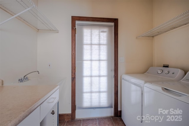 laundry room featuring separate washer and dryer, a sink, cabinet space, and tile patterned floors