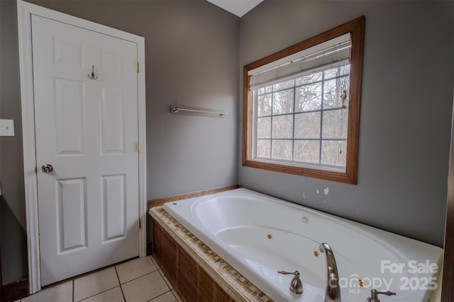 bathroom featuring tile patterned flooring and a jetted tub