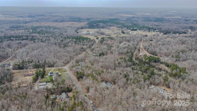 bird's eye view featuring a forest view