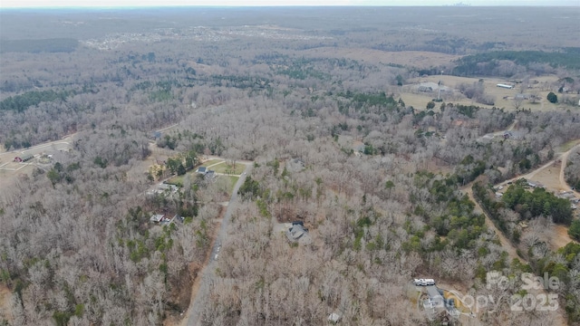 bird's eye view featuring a forest view