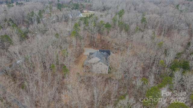 drone / aerial view with a view of trees