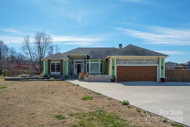 single story home with a front lawn and a garage