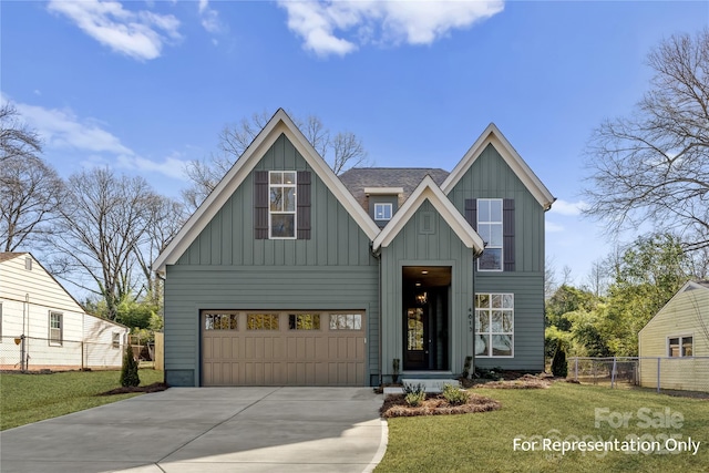 view of front of property with a front yard, fence, driveway, a shingled roof, and board and batten siding