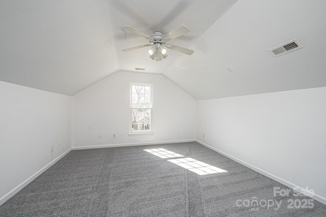 additional living space featuring ceiling fan, lofted ceiling, and carpet