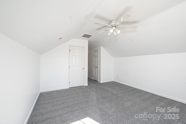 bonus room with vaulted ceiling, ceiling fan, and dark carpet