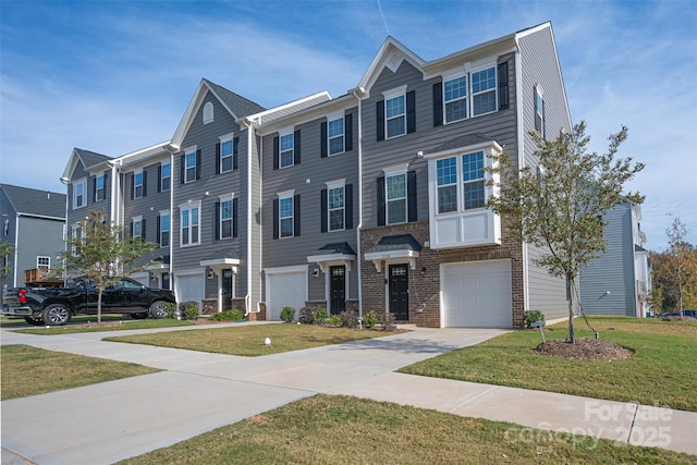 view of property with a front lawn, a residential view, concrete driveway, an attached garage, and brick siding