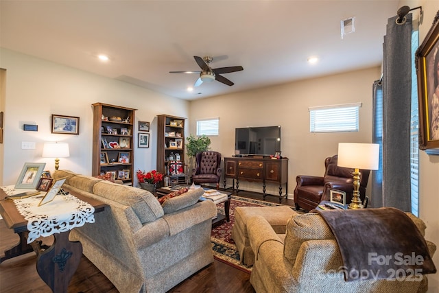 living room featuring ceiling fan, dark wood-type flooring, visible vents, and recessed lighting