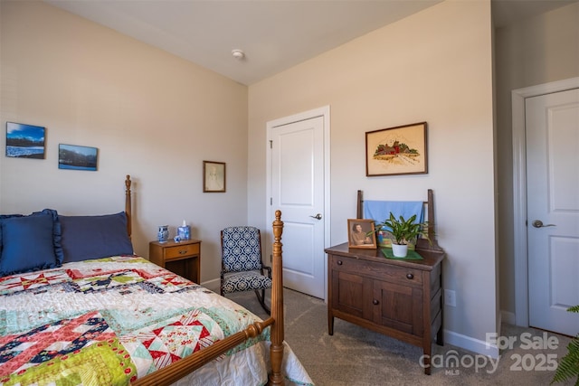 bedroom with carpet and baseboards