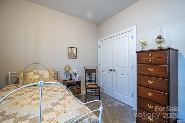 bedroom featuring a closet and dark carpet